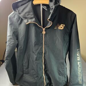 New Balance Women’s Black Windbreaker with Rose Gold Accents, two pockets